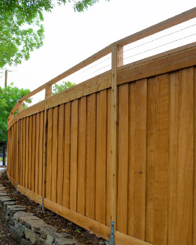 brown wooden fence next to walkway